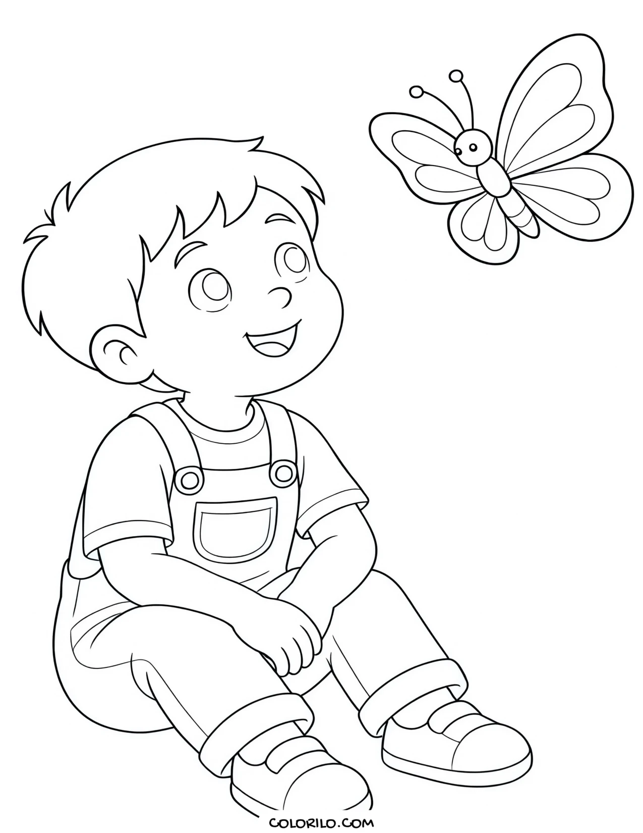 A preschool boy watching a butterfly coloring page